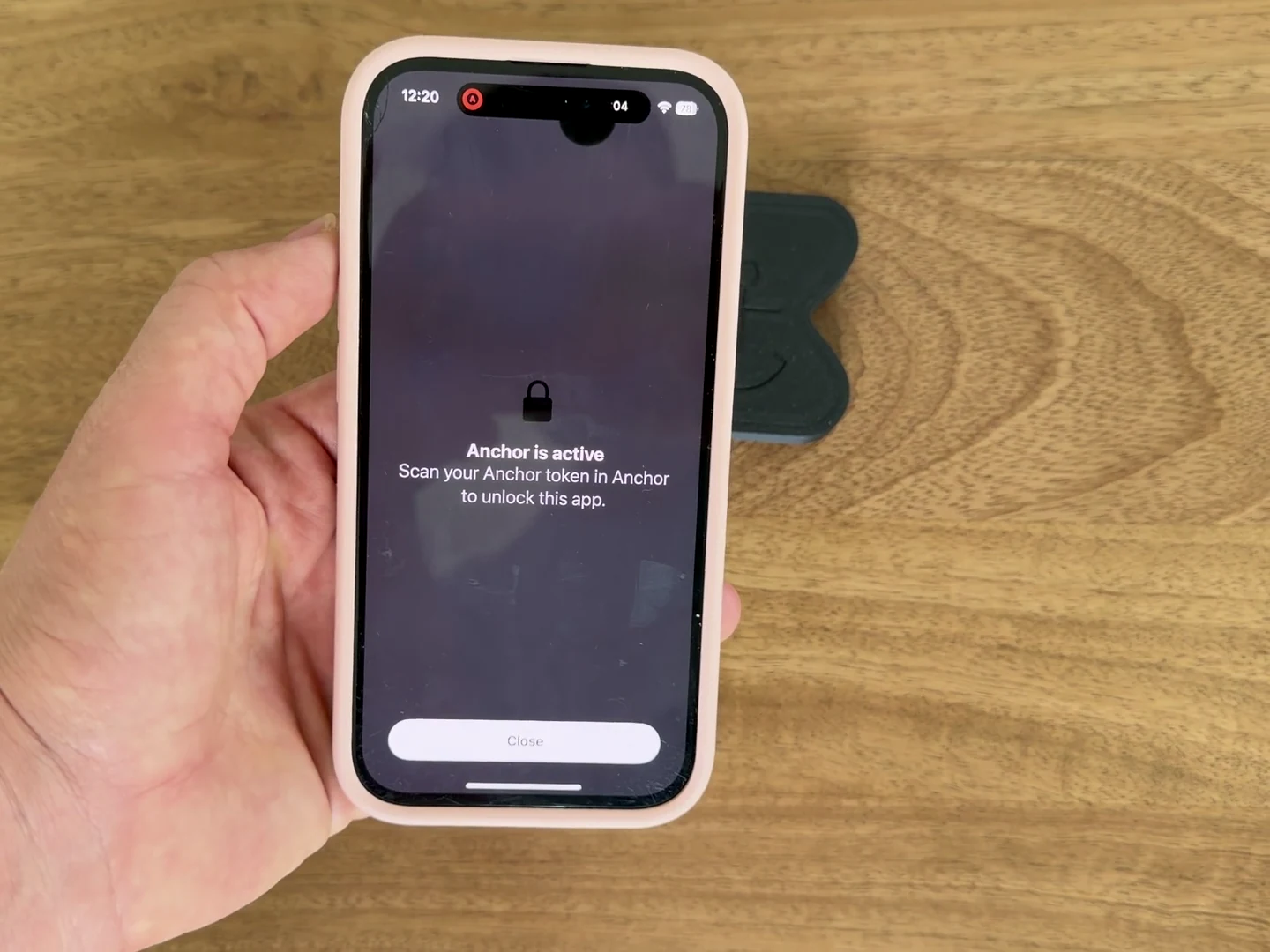 A phone showing Facebook blocked during Focus beside the physical Anchor